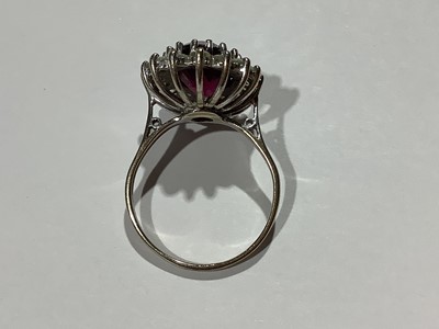 Lot 61 - A garnet and diamond cluster ring.