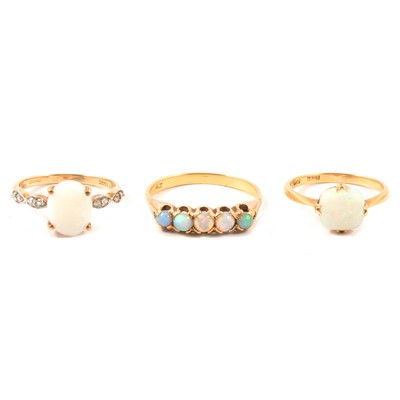 Lot 85 - Three opal dress rings.