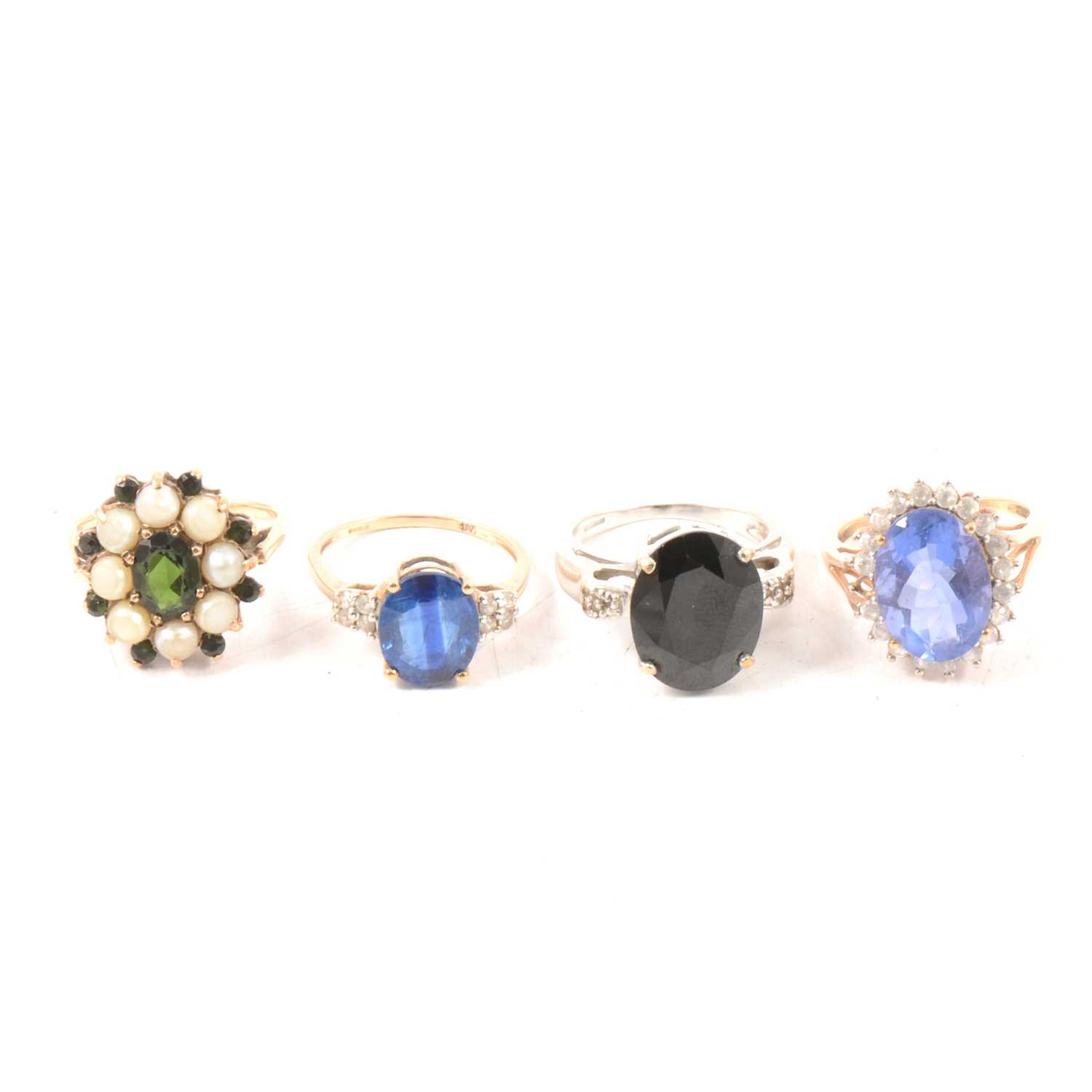 Lot 91 - Four blue and green stone dress rings.