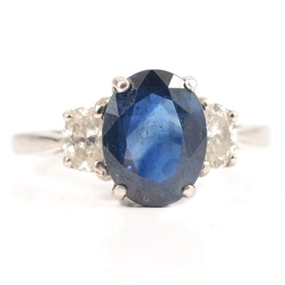 Lot 45A - A sapphire and diamond three stone ring.