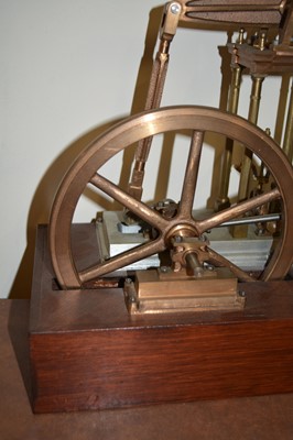 Lot 62 - Model beam engine, live steam, mounted on wooden plinth, unpainted, width of base 40cm.