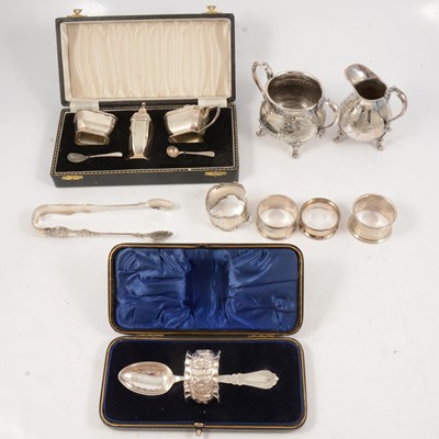 Lot 297 - Silver three-piece cruet, tongs, napkin rings, etc.