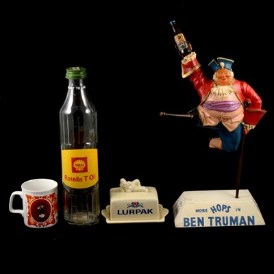 Lot 131 - Trumans stand, Muppets mug, Lurpak butter dish, Shell bottle, oil can, and two annuals.