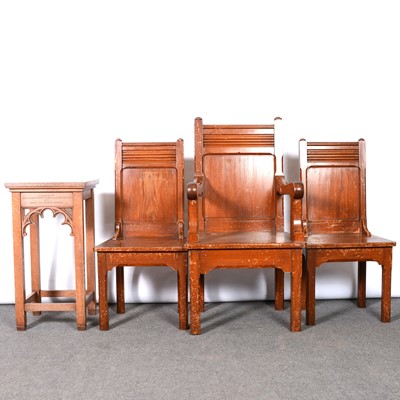 Lot 182 - Three Gothic style pine chairs, and a Gothic oak side table
