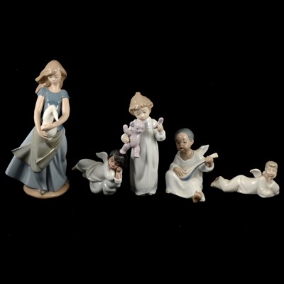 Lot 7 - Four Lladro and Nao figurines.