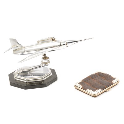 Lot 257 - Chromed table lighter in the form of a jet, and a silver-mounted crocodile skin wallet.