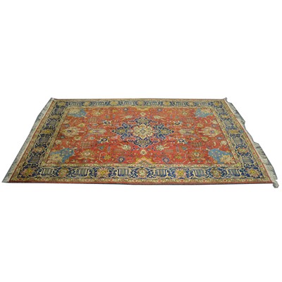 Lot 552 - Large Persian carpet, central navy and cream medallion, red ground with allover floral motifs