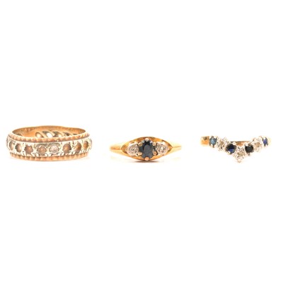 Lot 101 - Three stone set dress rings.