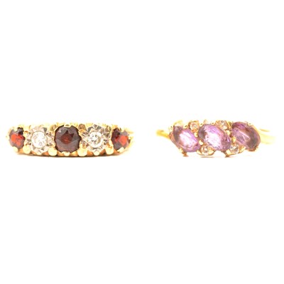 Lot 242 - A garnet dress ring and an amethyst dress ring