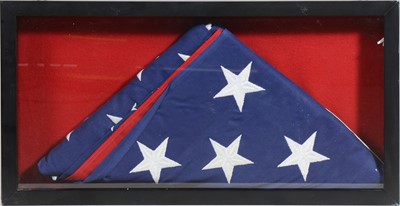 Lot 151 - American Stars and Stripes flag, folded, box frame