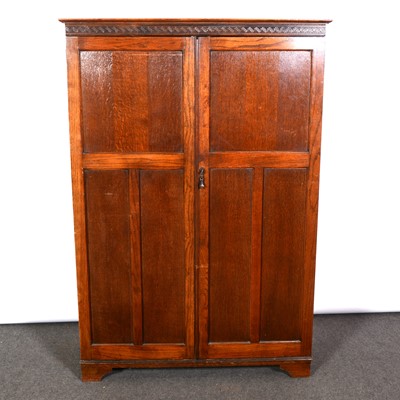 Lot 336 - Small oak compactum wardrobe, moulded cornice...