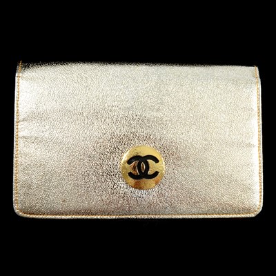 Lot 434 - Chanel - a gilded leather evening clutch bag.