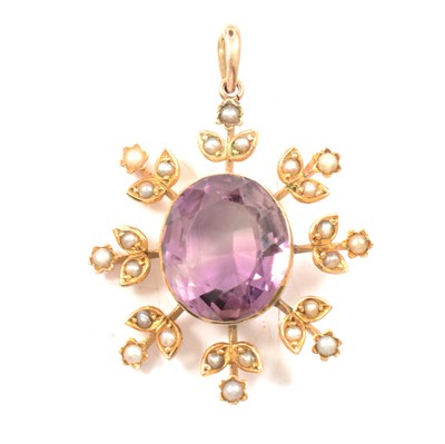 Lot 229 - An Edwardian amethyst and seed pearl pendant.