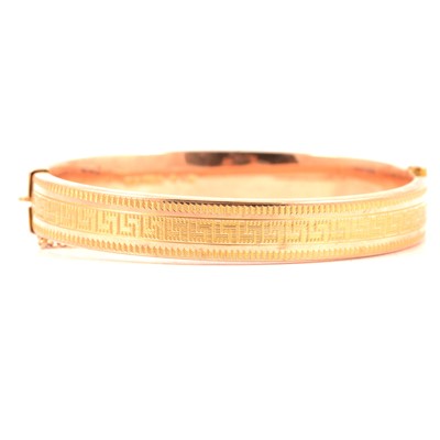 Lot 194 - A 9 carat yellow gold half hinged bangle.