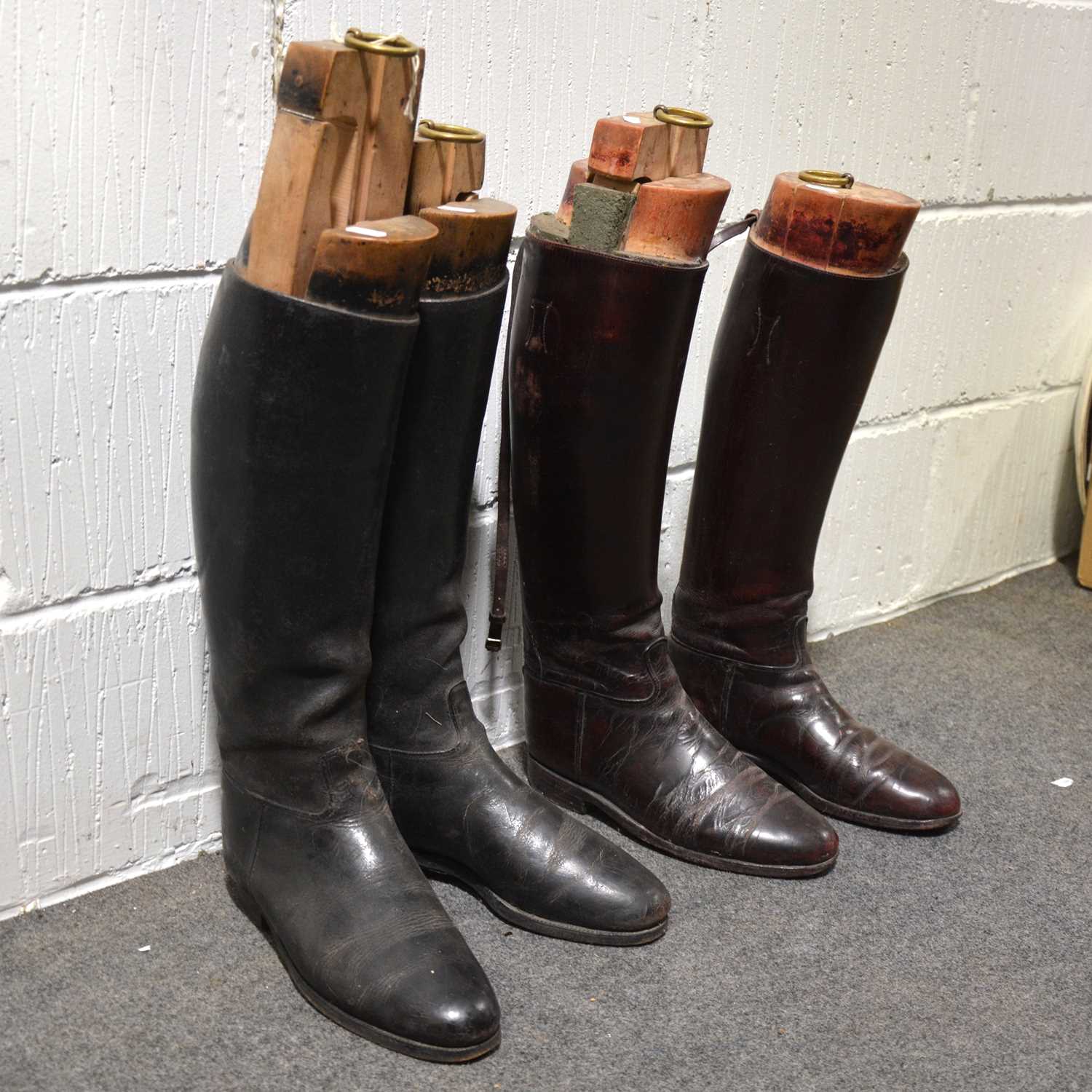 Lot 259 - Two pairs of leather riding boots with wooden trees
