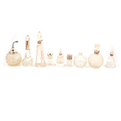 Lot 255 - Fifteen silver or white metal-mounted / topped scent bottles, pots and atomisers, and two glass scent bottles.