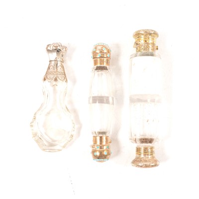 Lot 228 - Silver-mounted double-ended scent bottle, another and a white metal mounted scent bottle.