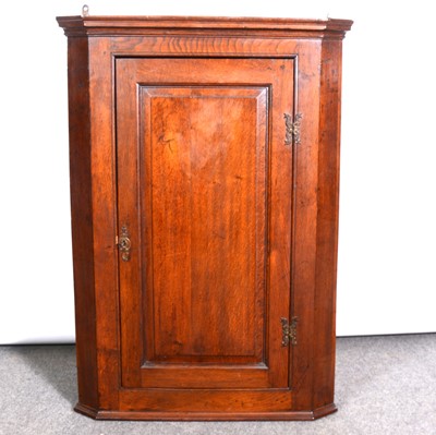 Lot 321 - George III oak hanging corner cupboard