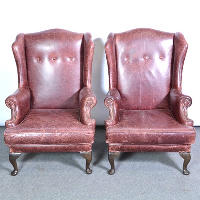 Lot 392 - Pair of leather wing back easy chairs