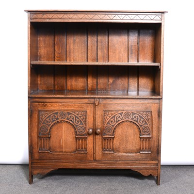 Lot 389 - Golden oak bookcase / cabinet