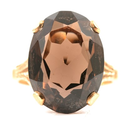 Lot 100 - A smoky quartz dress ring.