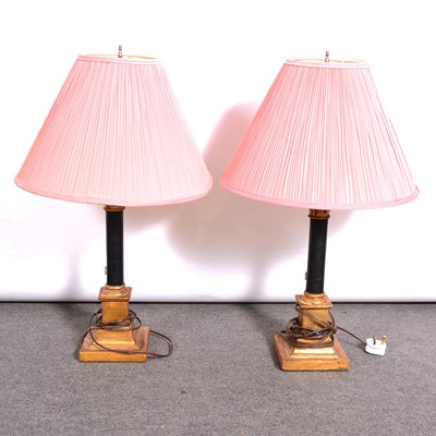 Lot 189 - Pair of ebonised and parcel gilt Corinthian column table lamps