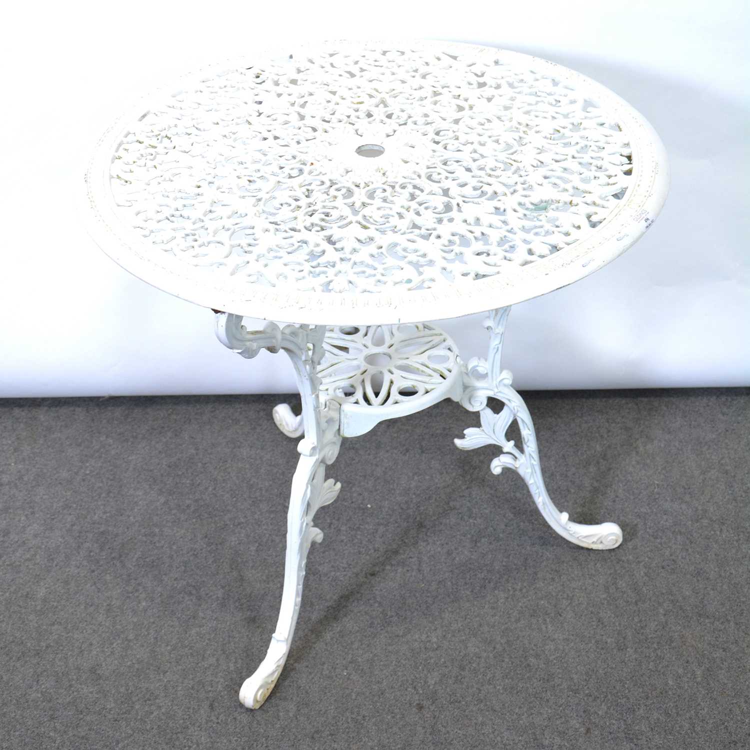 Lot 496 - White cast metal patio table and single