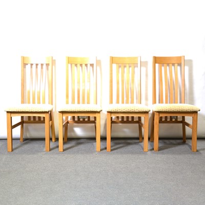 Lot 366 - Contemporary light oak extending dining table and four chairs