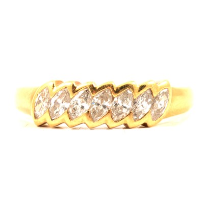 Lot 228 - A diamond seven stone marquise cut half hoop ring.