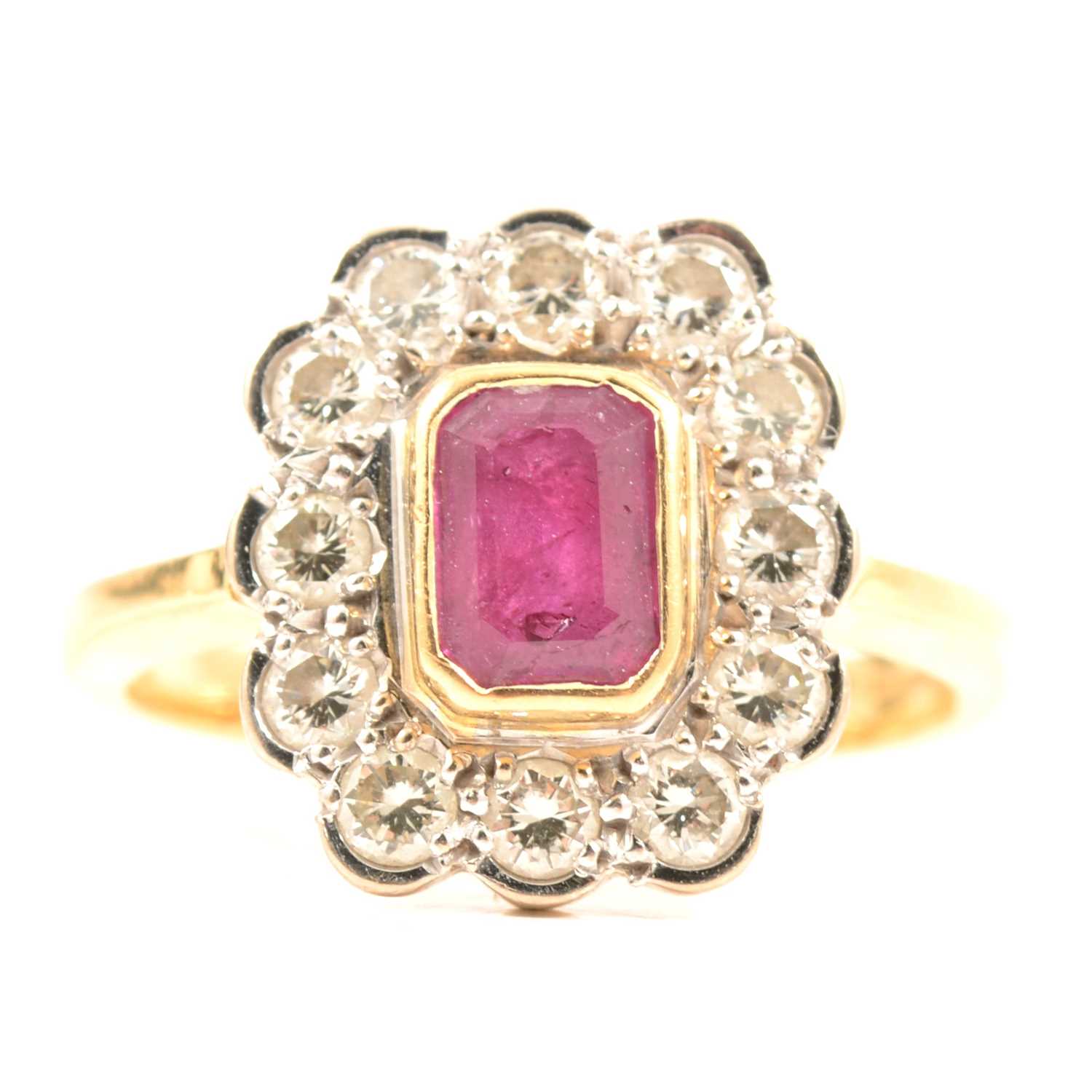 Lot 68 - A ruby and diamond cluster ring.