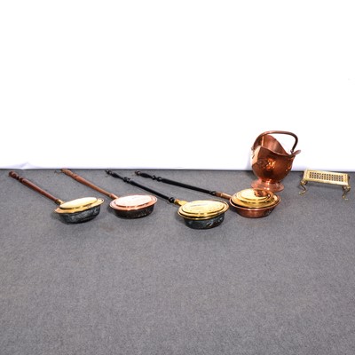 Lot 194 - Four copper/brass warming pans; copper scuttle and brass trivet; candlesticks, pans.