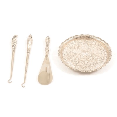 Lot 297 - Small white metal tray, silver-handled shoe horn and two silver-handled buttonhooks.