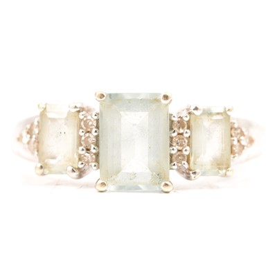Lot 94 - An aquamarine and diamond ring.