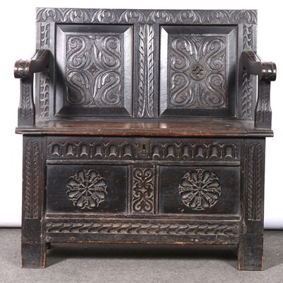 Lot 405 - A carved oak monk’s bench