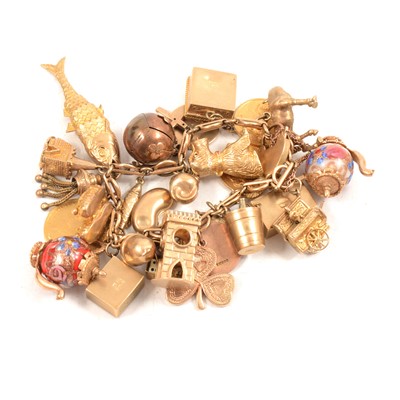 Lot 171 - A 9 carat gold charm bracelet with charms.