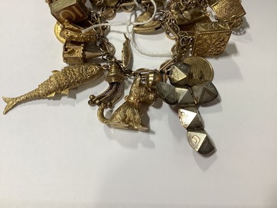 Lot 171 - A 9 carat gold charm bracelet with charms.