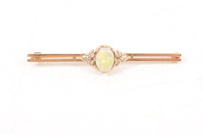 Lot 205 - An opal and diamond bar brooch.