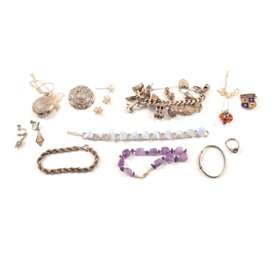 Lot 392 - A collection of silver jewellery, charms bracelet, locket, pendants, stone bracelets.