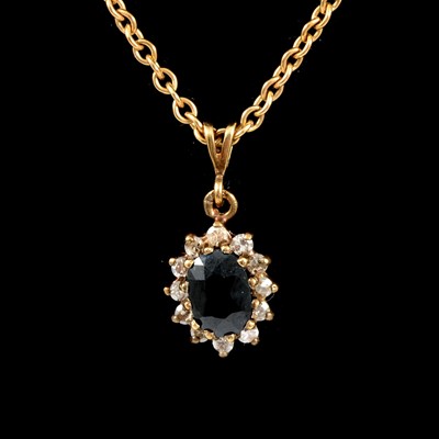 Lot 59 - A matching pendant and chain, earstuds and ring.