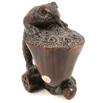 Lot 230 - Signed wooden netsuke of a frog, 50mm.