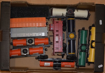 Lot 22 - MTH O gauge model railway Offset Steel Caboose, tanker wagons and freight.