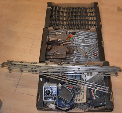 Lot 186 - Three trays of O gauge model railway track and controllers, mostly 3-rail.