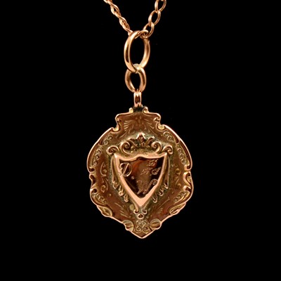 Lot 277 - A 9 carat rose gold medallion and chain.