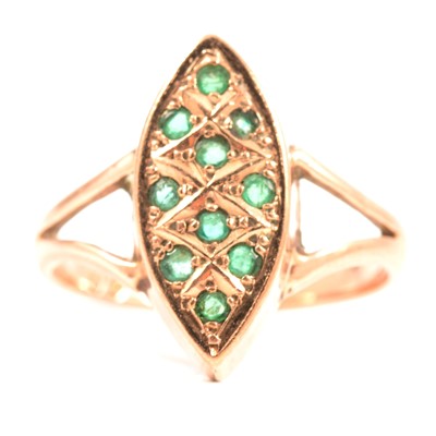 Lot 62 - An emerald marquise cluster ring in 9 carat rose gold.