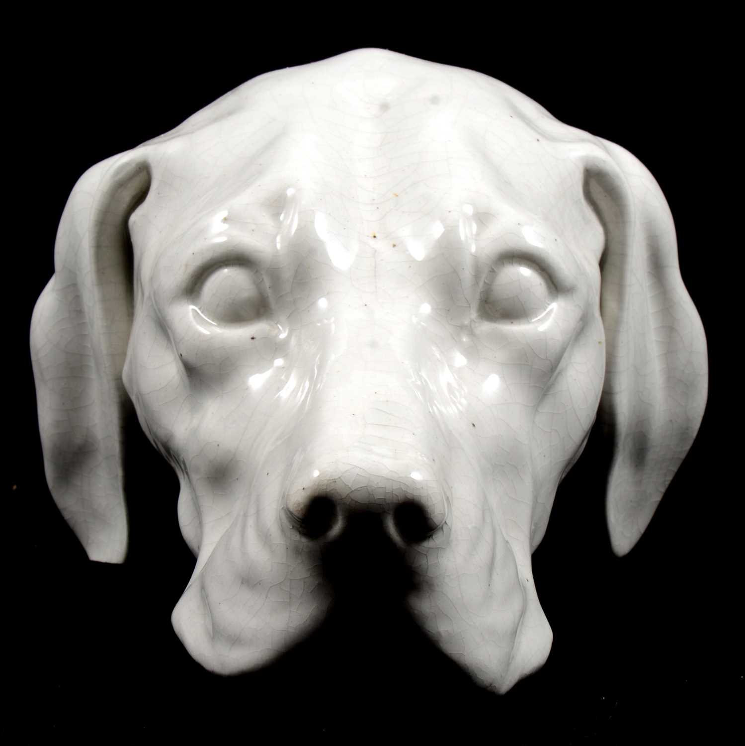 Lot 22 - Continental pottery dog head wall mask.