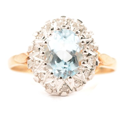 Lot 234 - A heat treated blue topaz and diamond cluster ring.