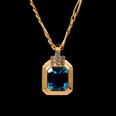 Lot 235 - A heat treated blue topaz pendant and chain.