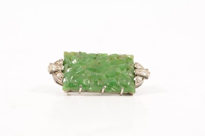 Lot 207 - A jade and diamond brooch.