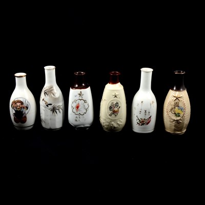 Lot 43 - Six Japanese military sake bottles.