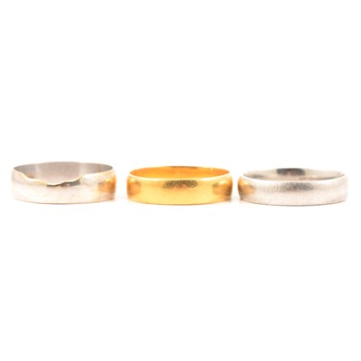 Lot 132 - Three wedding bands, 22 carat yellow gold, rhodium plated 18 carat yellow gold and platinum.